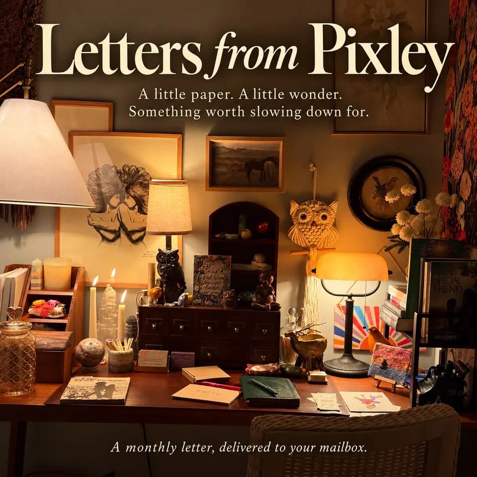Sarah's desk glowing in lamplight, crowded with candles, books, an owl and kraft envelopes, under the words Letters from Pixley: a monthly letter, delivered to your mailbox